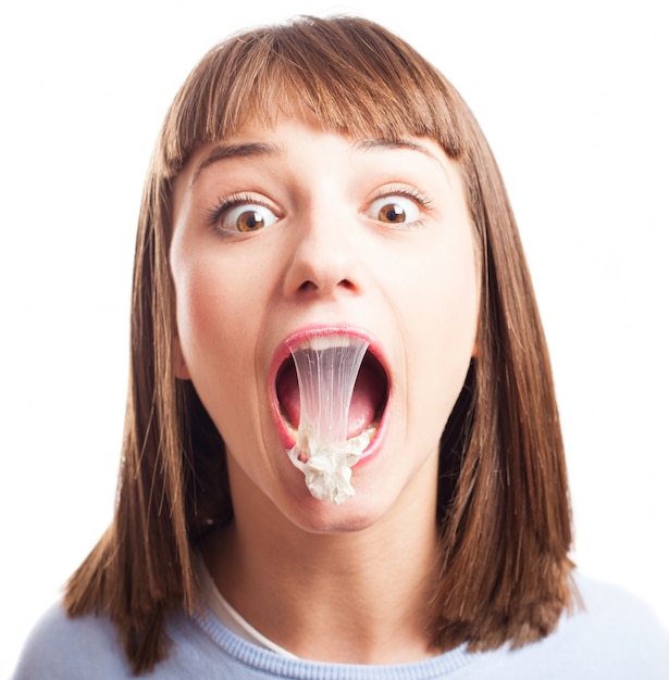 Free photo funny girl with chewing gum in the mouth