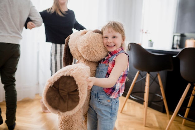 Funny girl with plush toy