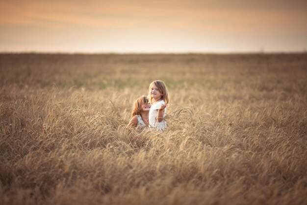 Funny girls playing with rye at sunset lifestyle