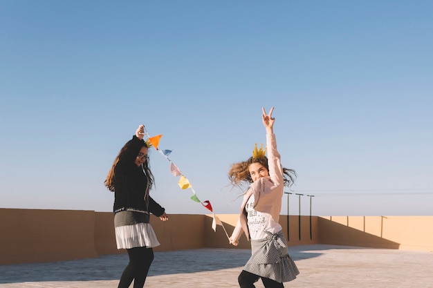 Funny girls with flag garland