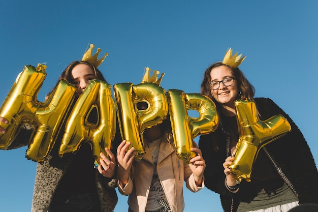 Funny girls with happy writing