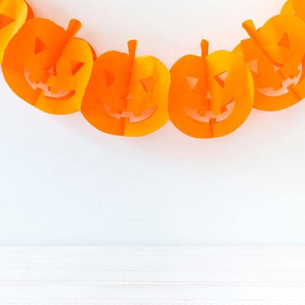 Funny Halloween garland hanging on wall