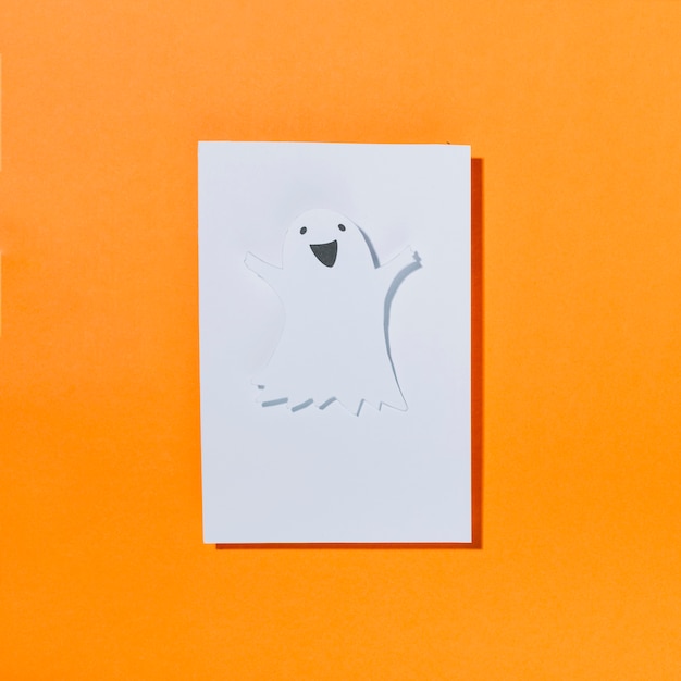 Free photo funny halloween ghost on piece of paper