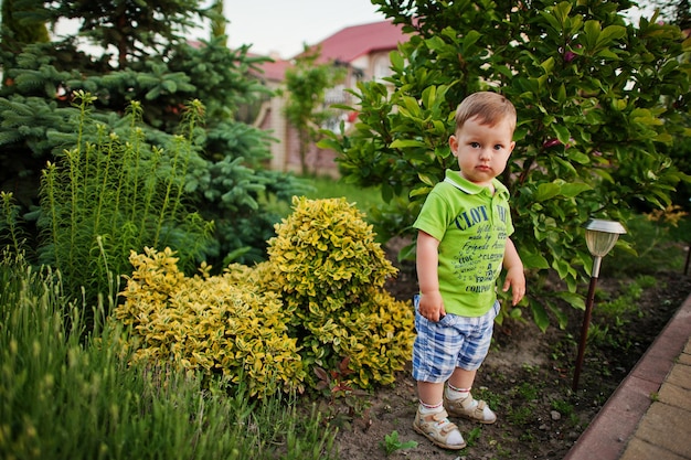 Funny little boy in the courtyard play