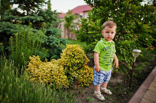 Funny little boy in the courtyard play