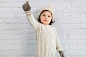 Free photo funny little girl winter dressed