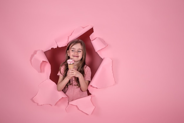 funny little girl with ice cream on colored background