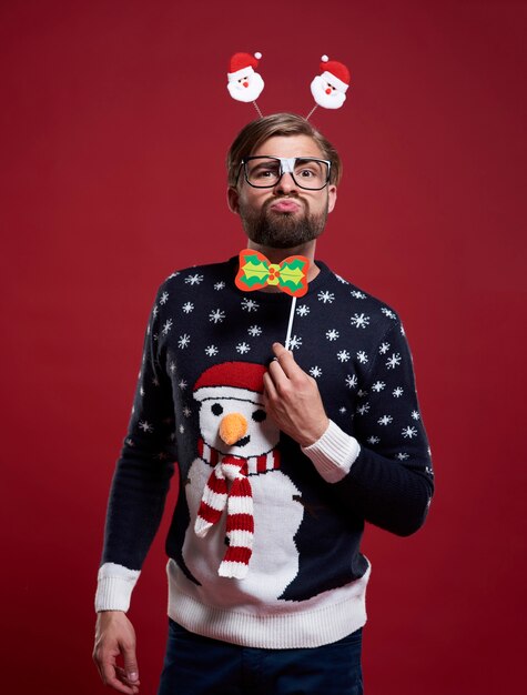 Funny man in Christmas time clothes isolated