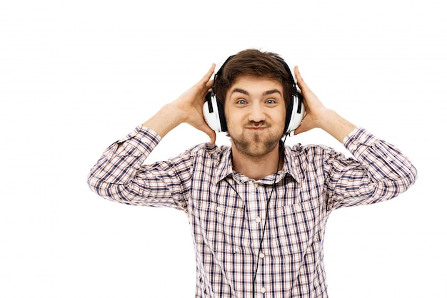 Free photo funny man enjoy listening music in headphones