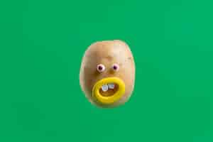 Free photo funny potato with face sticker