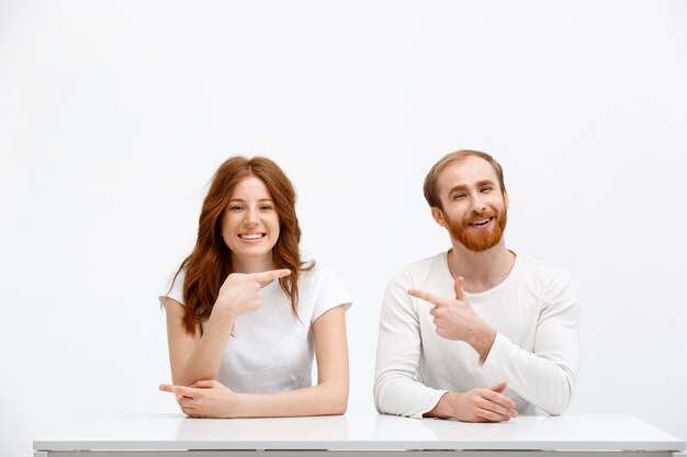 Funny redhead man and woman accuse each other