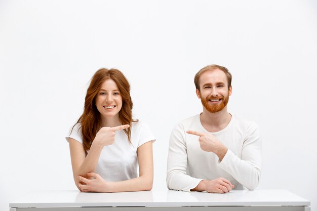 Funny redhead siblings point each other