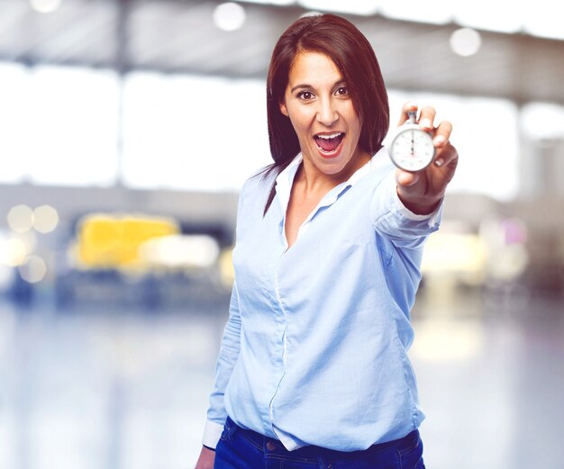 Funny woman showing a chronometer