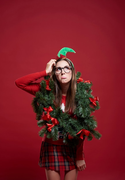 Funny woman with Christmas garland isolated