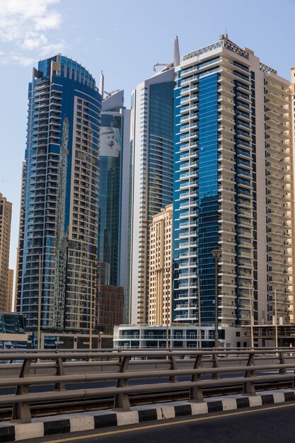 Futuristic city landscape of skyscrapers in sunny day.