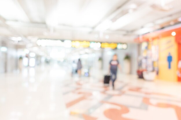 Fuzzy view of tourist with suitcase