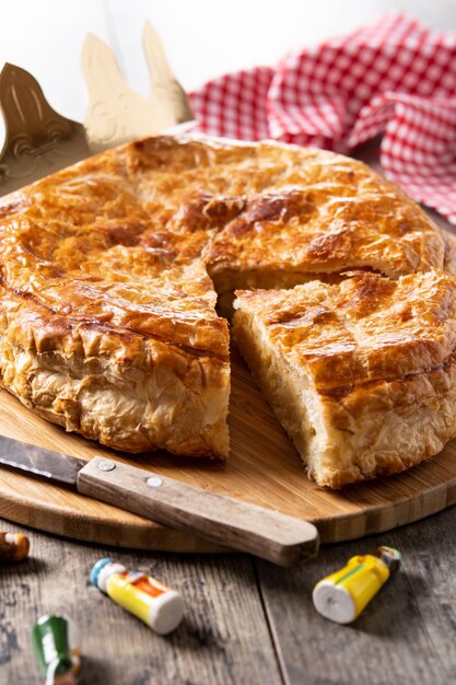 Galette des rois on wooden table. Traditional Epiphany cake in France