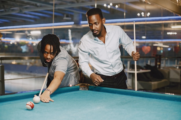 Game of billiards. Men with a cane. Men's games