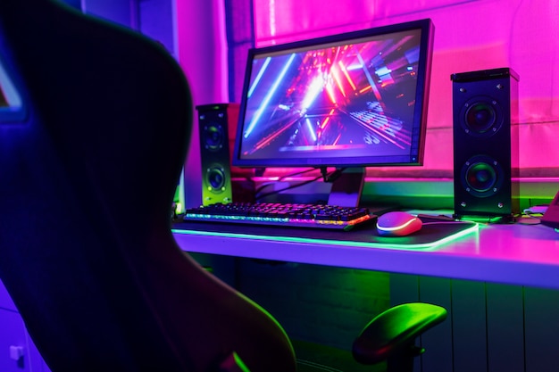 Free photo gamer chair with multicolored neon lights