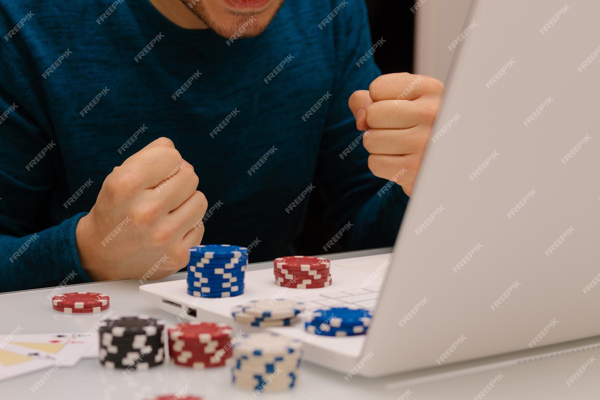 Premium Photo | Gamer man playing with his laptop from home to casino games, poker, blackjack, roulette. concept of online gambling, win money, sports bet, chance, succeed, fortune, addiction.