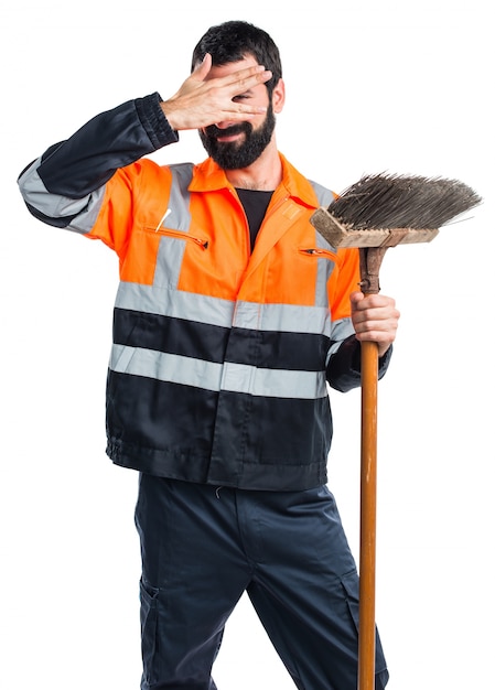 Free photo garbage man covering his face