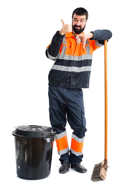 Free photo garbage man making good-bad sign