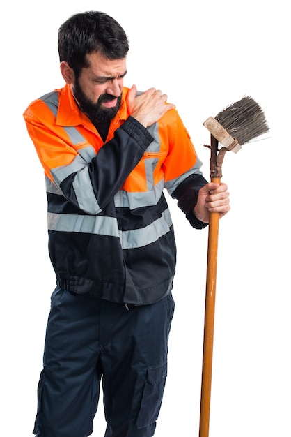 Free photo garbage man with shoulder pain