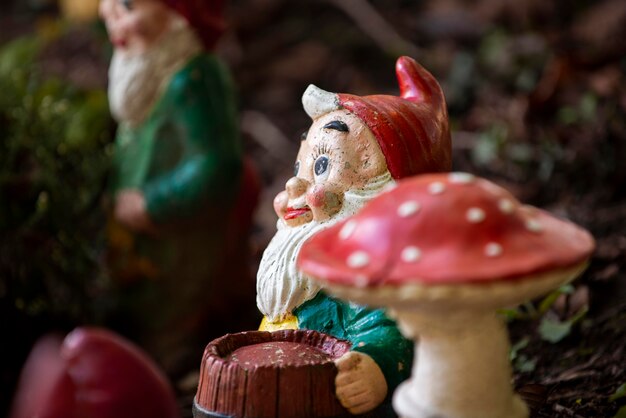Garden gnome with funny hat outdoors