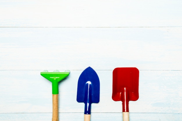 Garden tools on wooden background