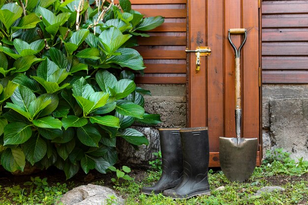 Gardener tools beside house