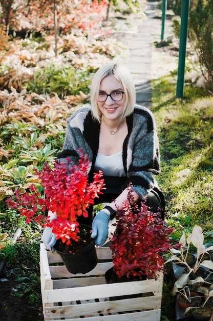 Free photo gardener with wooden box