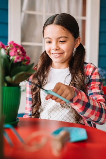 Gardening concept with girl and plant