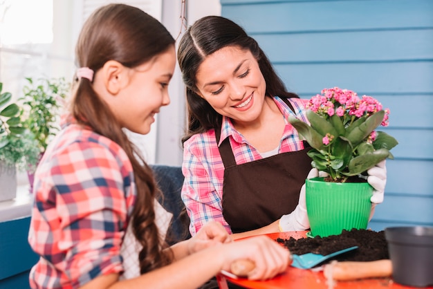 Gardening concept with mother and daughter