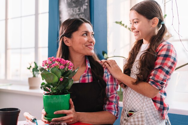 Gardening concept with mother and daughter