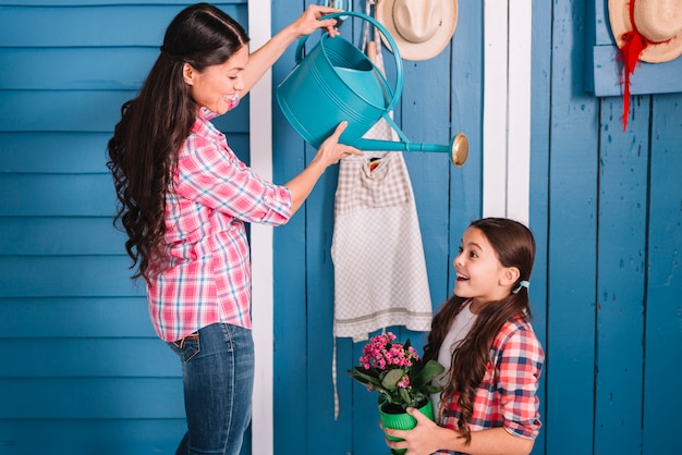 Gardening concept with mother and daughter