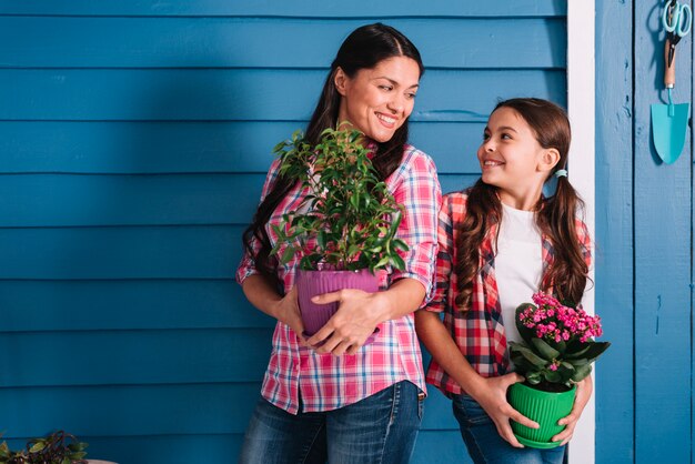 Gardening concept with mother and daughter