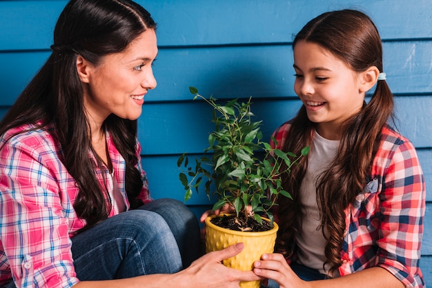 Gardening concept with mother and daughter