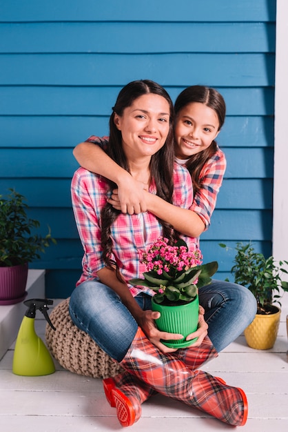 Gardening concept with mother and daughter