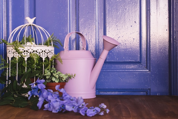 Free photo gardening concept with watering can and plants