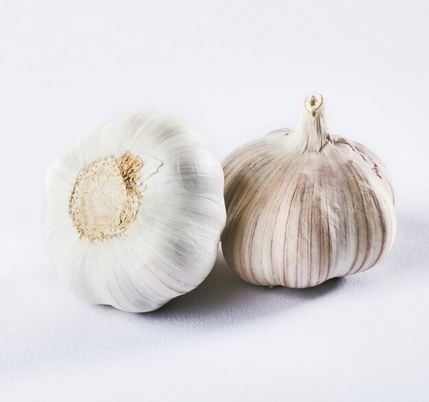 Garlic isolated on a white. Delicious seasoning