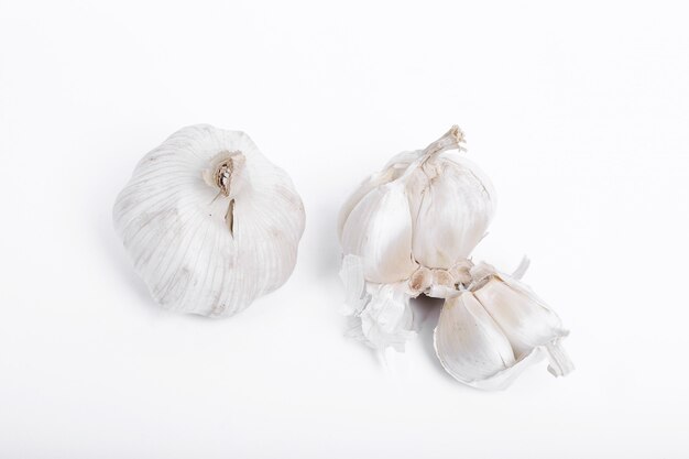 Garlic on white surface