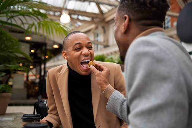 Free photo gay couple out on a date in the city