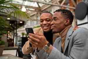 Free photo gay couple out on a date in the city