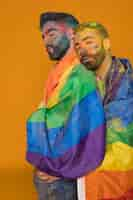 Free photo gay couple in rainbow powder