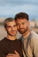 Free photo gay couple spending time together on the beach