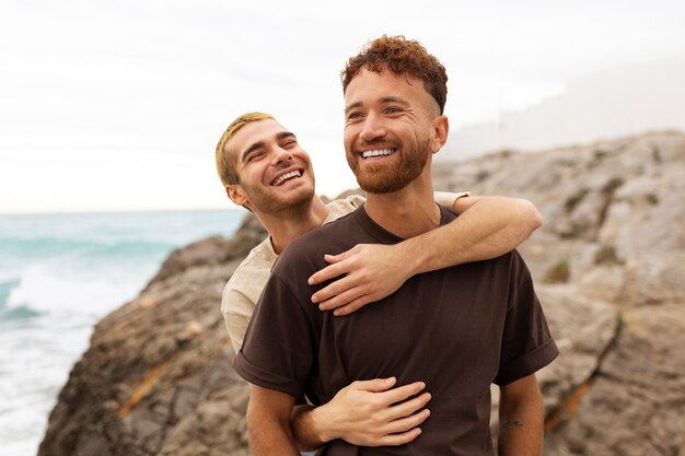 Gay couple spending time together on the beach