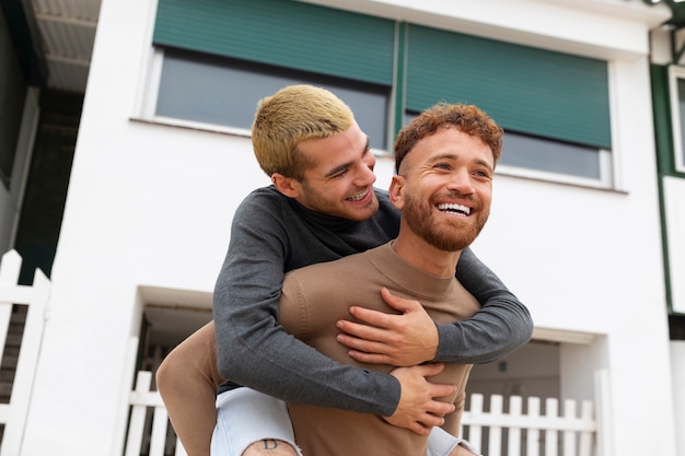 Gay couple spending time together on the beach