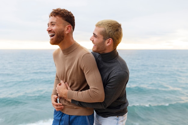 Gay couple spending time together on the beach