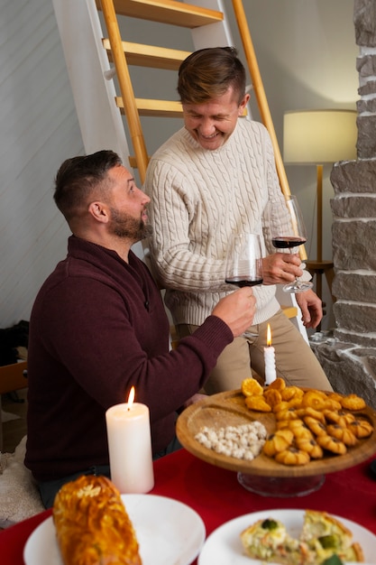 Free photo gay couple spending time with family