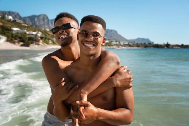 Gay male couple on the beach